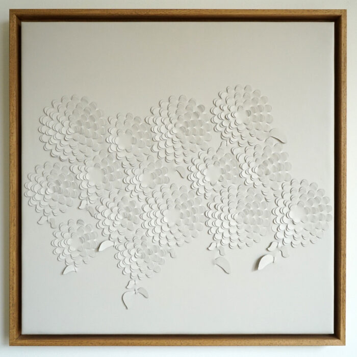A leather artwork framed for wall mounting by Louise Heighes and entitled Crysanthemum