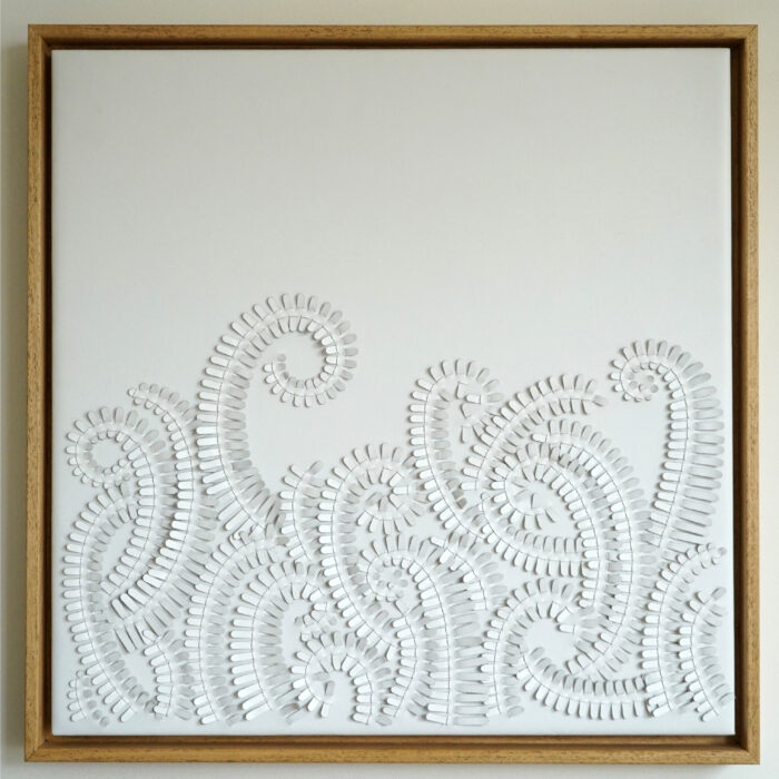 Abstract white leather artwork by Louise Heighes of ferns shown framed