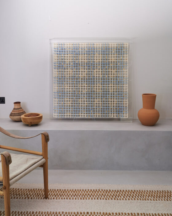Woven, a multilayered artwork by Gill Wilson shown in a room set leaning against a wall