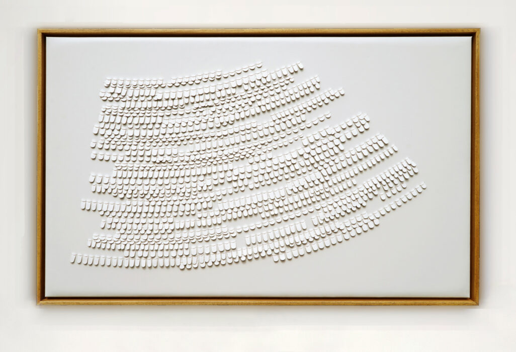 White cut and woven leather artwork inspired by bird feathers by Louise Heighes, also offered custom made to order